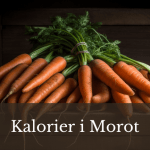 Färska morötter på en skärbräda